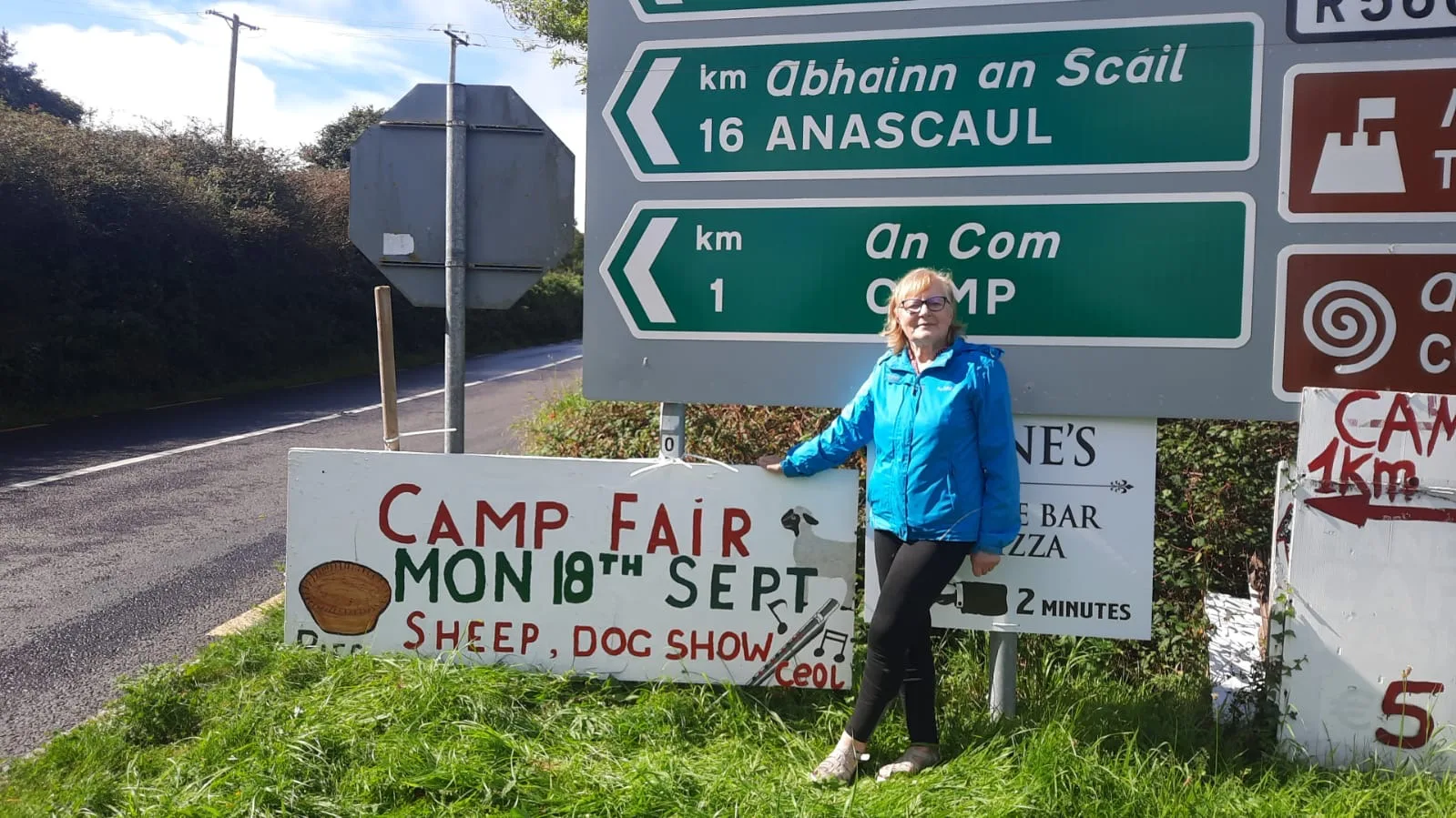 Camp and Annascaul road signs beside a local fair announcement