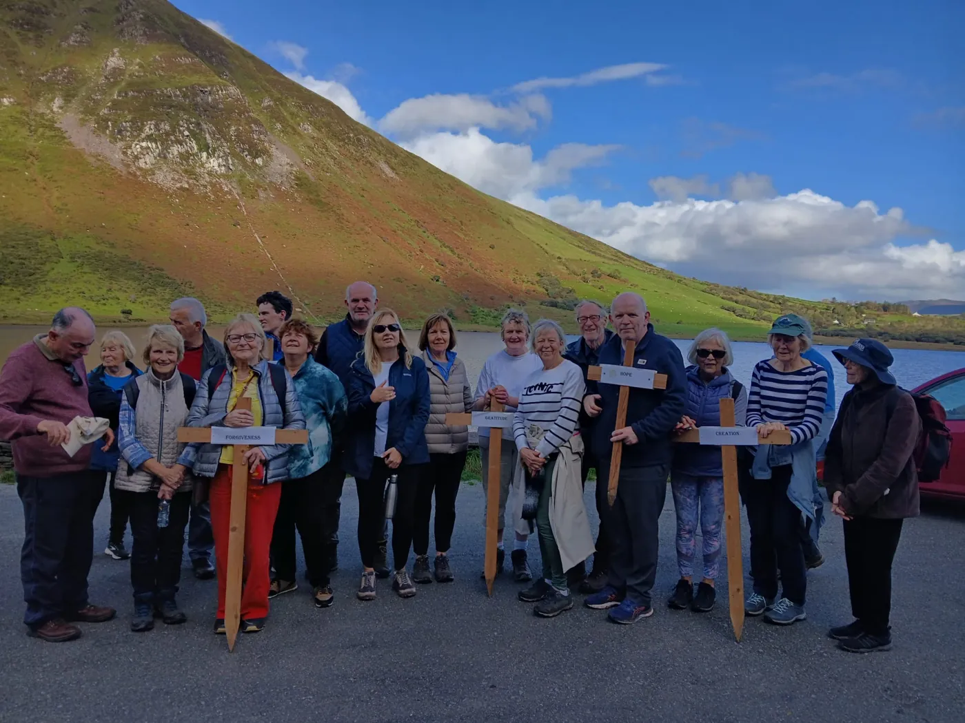 A group of walkers gathered in the mountains