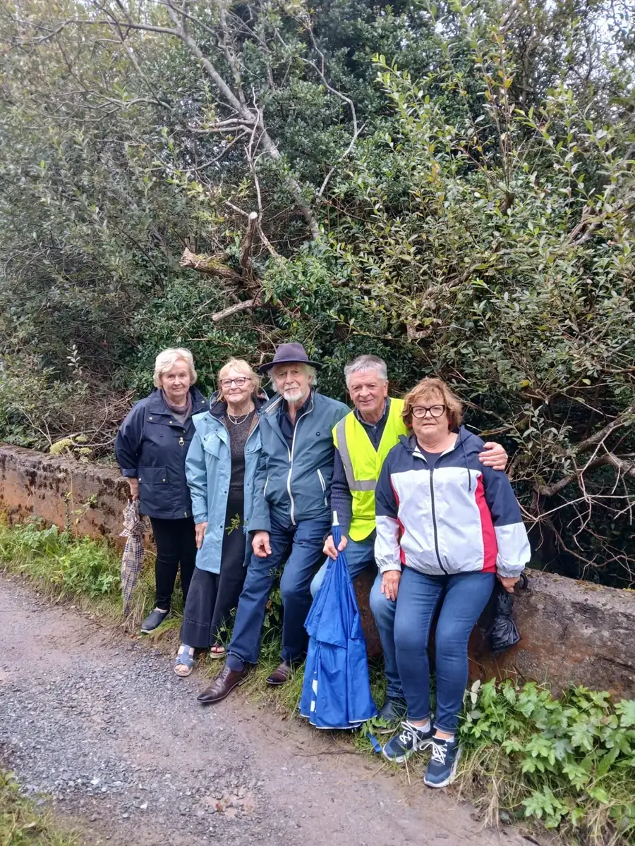 A walking group on a woodland path